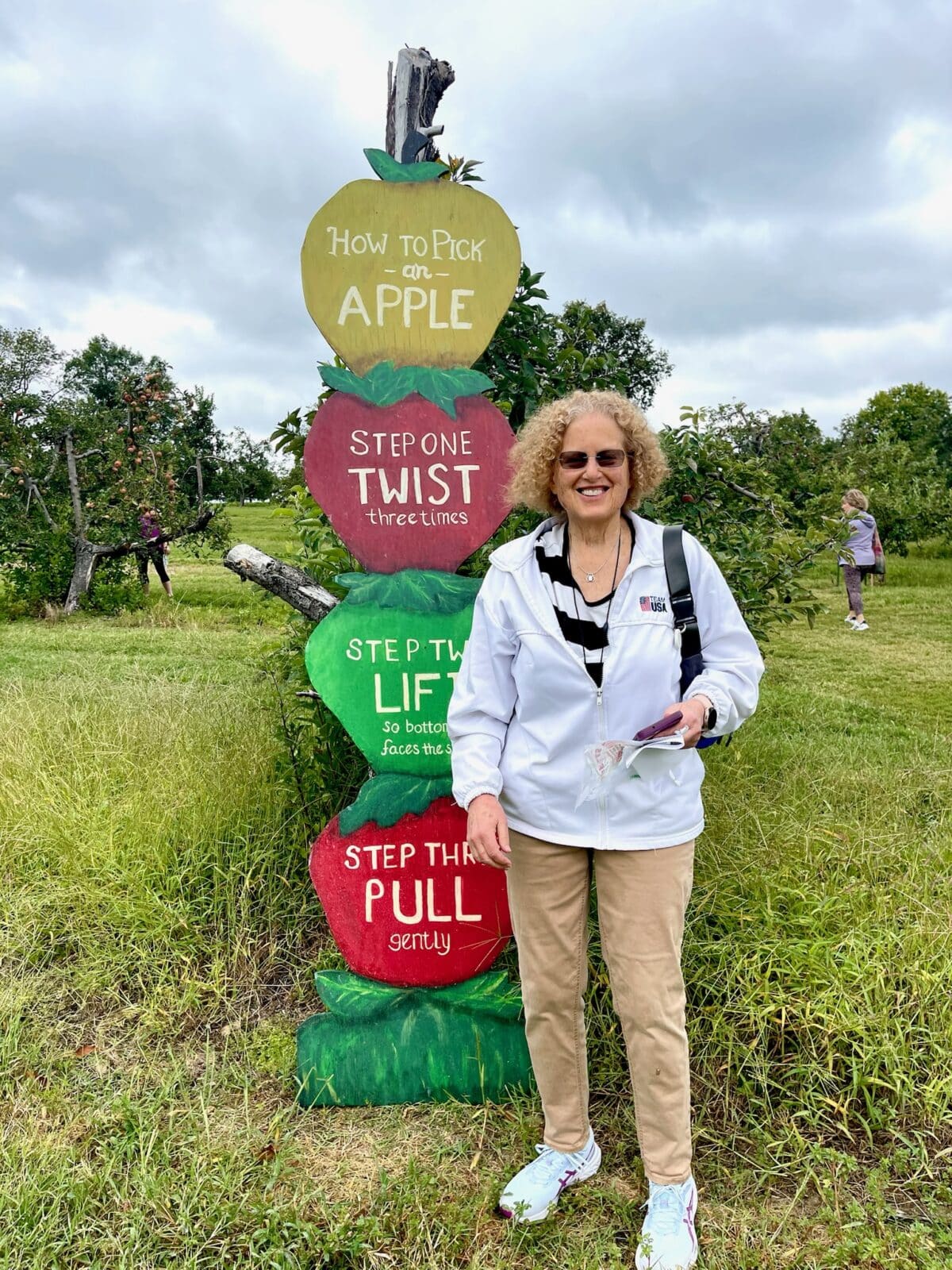 residents at an apple orchard event